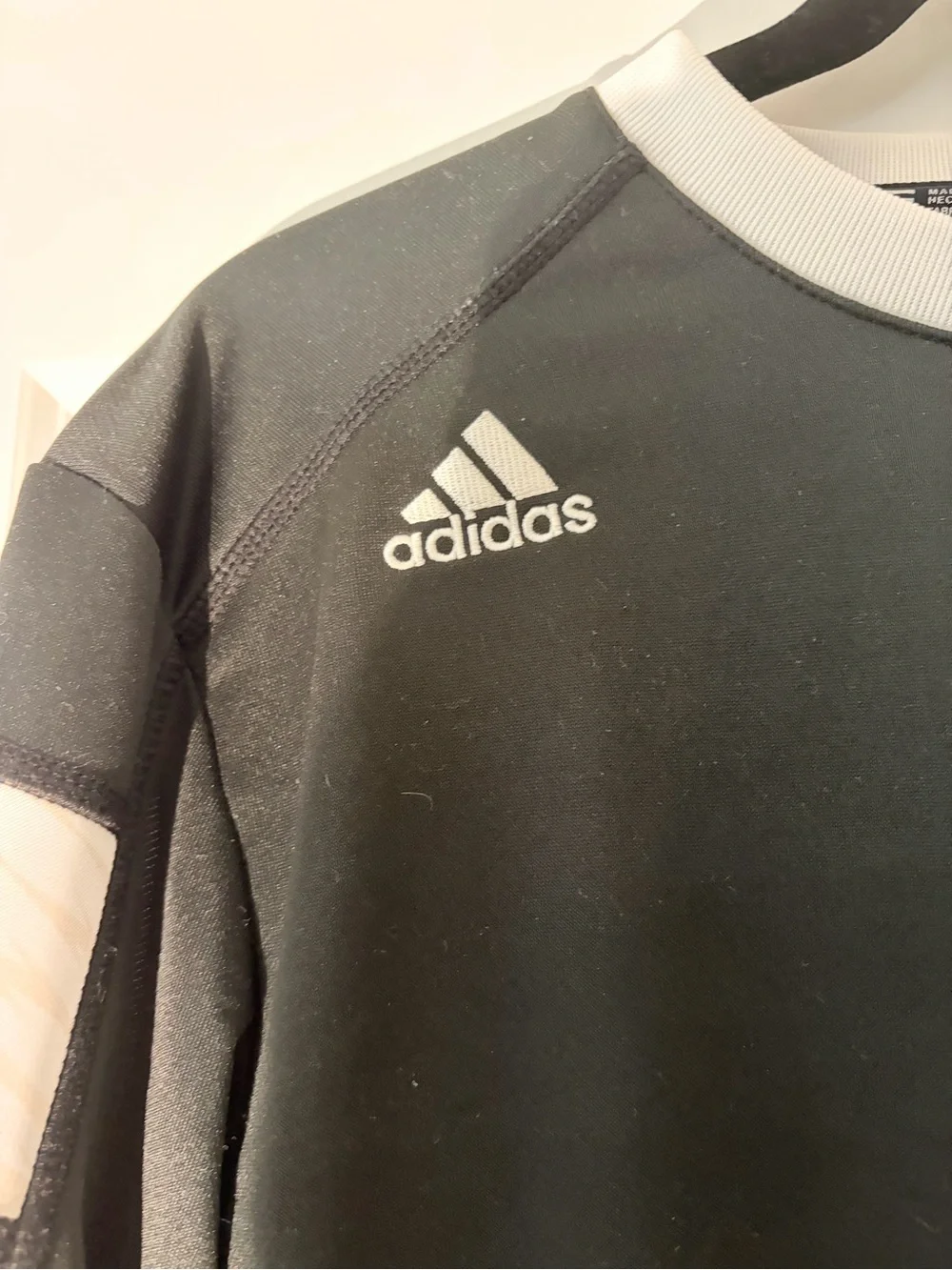 adidas Black Long-Sleeve Crew with White Trim and Orange 'T' Logo